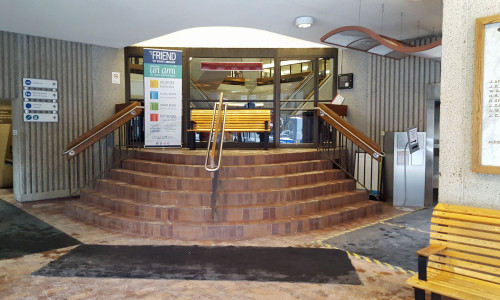 Inside the entry vestibule looking up towards the original diagonally-placed entry