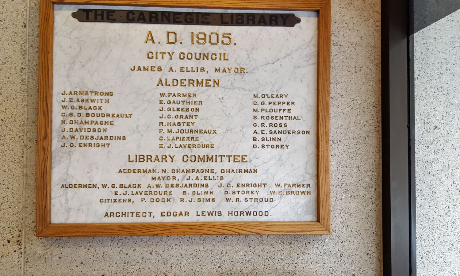 Marble marker retained from the earlier Carnegie library