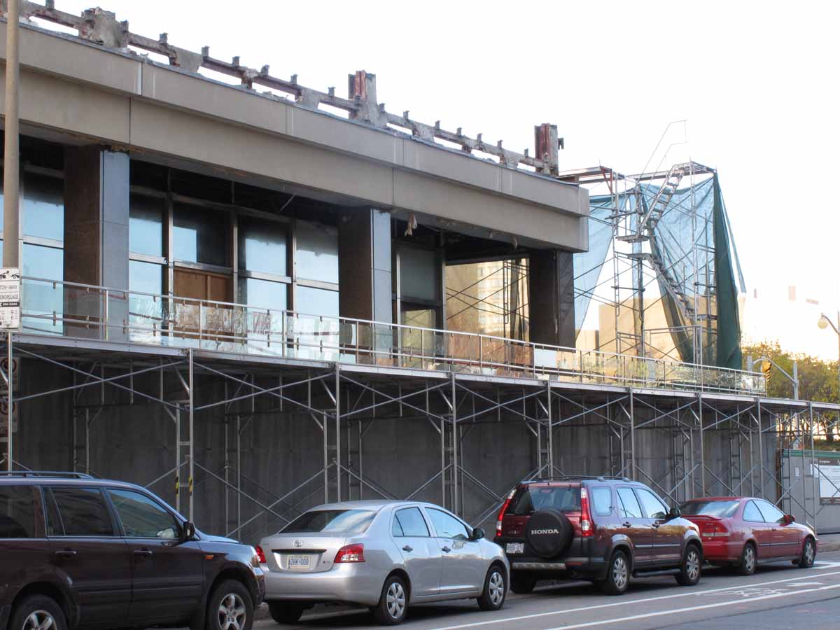 Southeast corner of building. One storey above granite plinth remaining