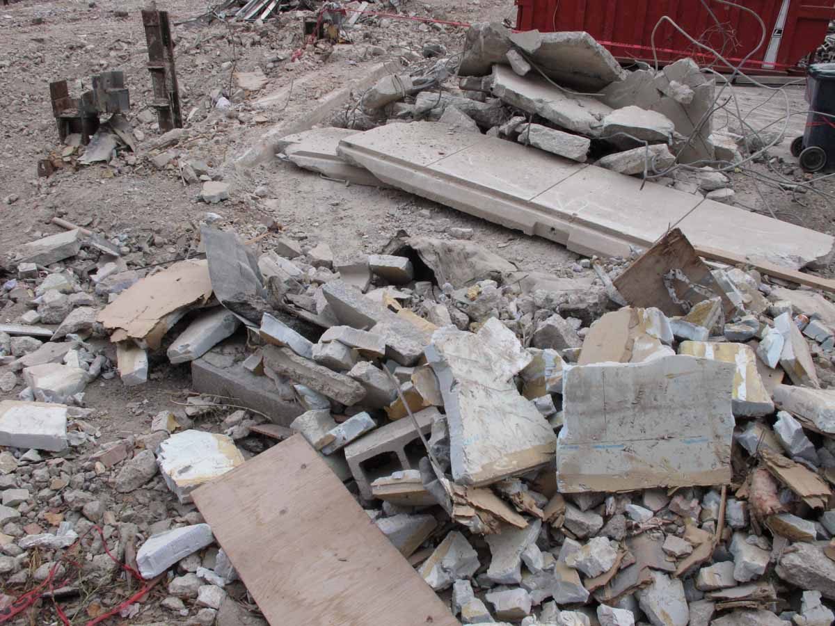 Granite panels in pile of demolition debris