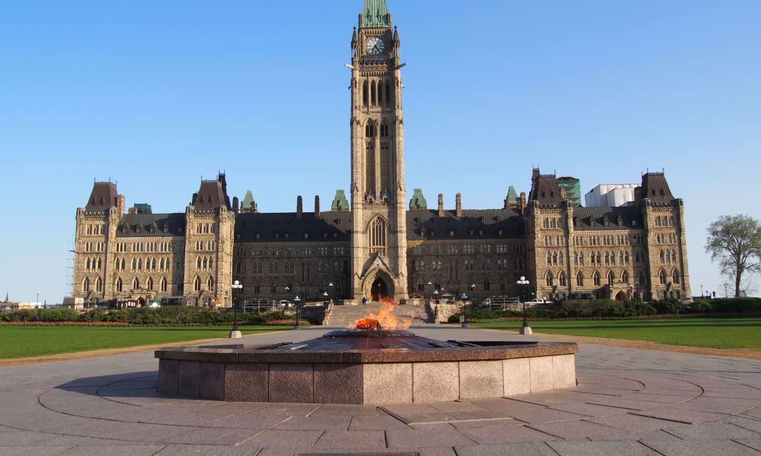 The central axis of the Peace Tower with the flame in the foreground