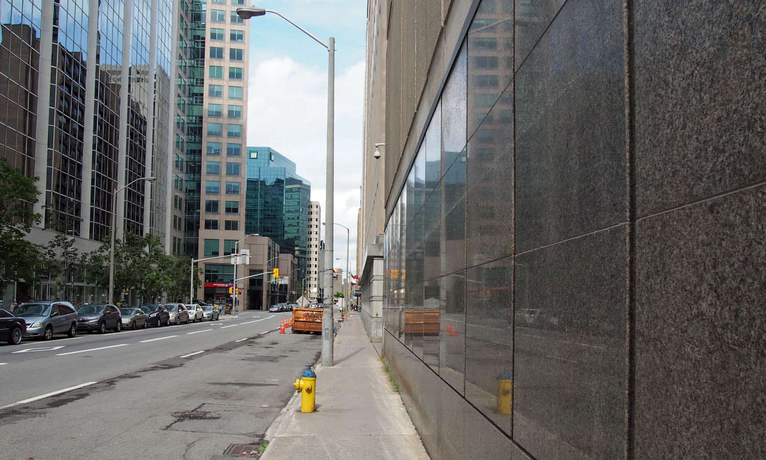 Continuous polished granite along the sidewalk edge