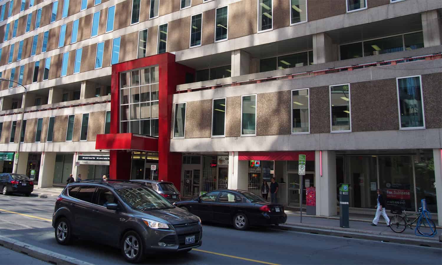 Laurier Avenue elevation looking east with a new entry element. This element weakens the colonnade by making it discontinuous