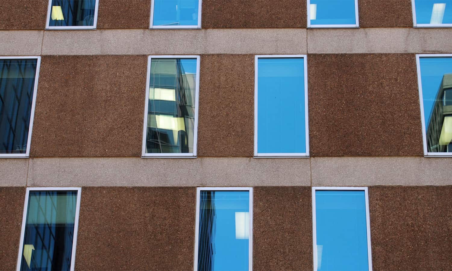 Windows within the elevations are randomly placed within a grid, but always related to the floors above and below