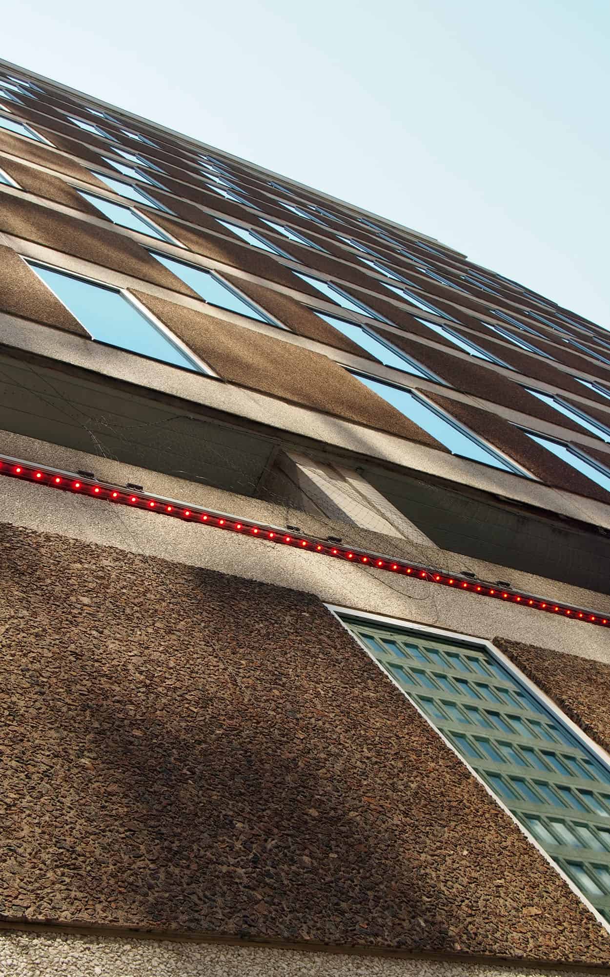 Looking up at the Laurier Avenue elevation highlighting the exposed aggregate of the two different coloured precast panels